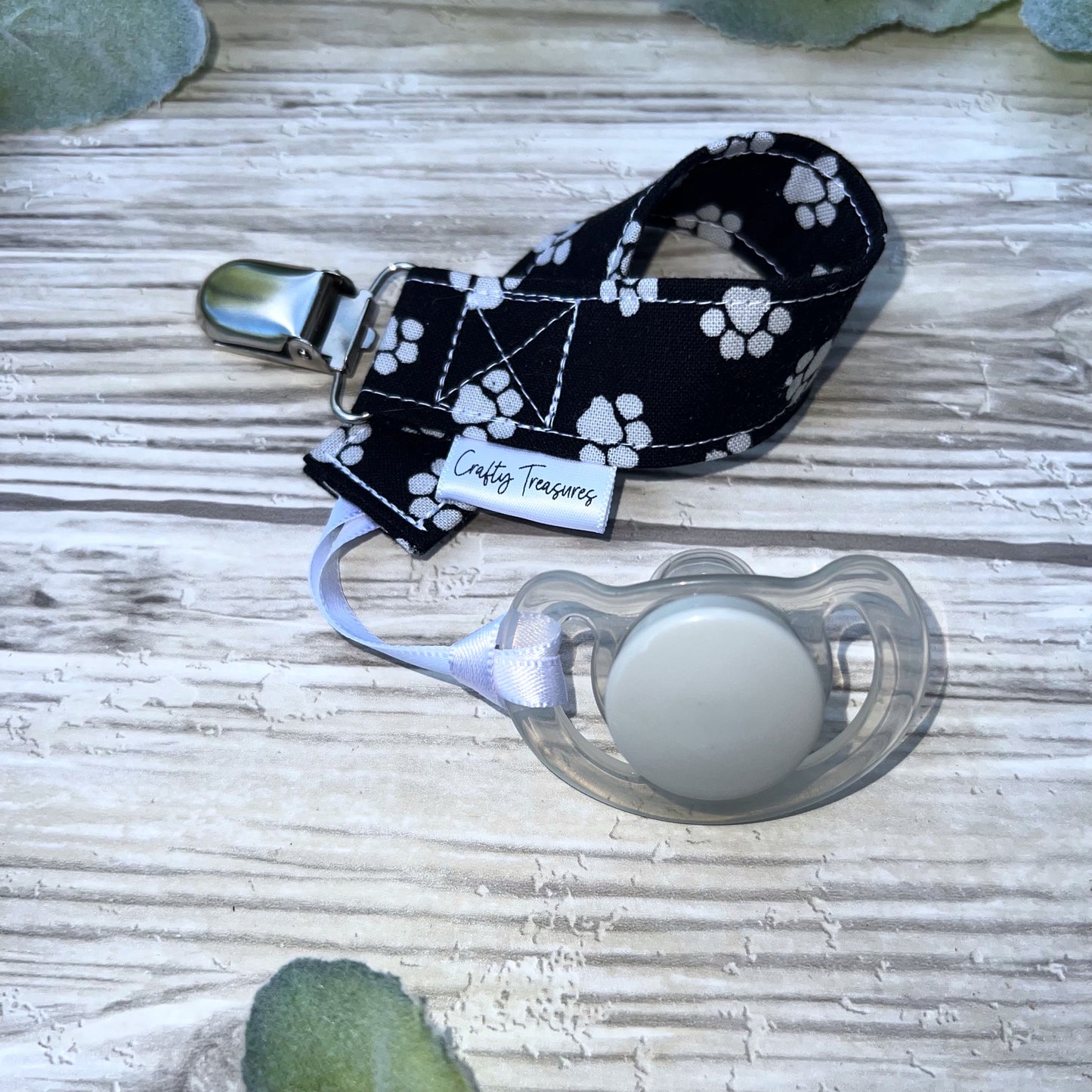 Pawprints on Black Pacifier Clip