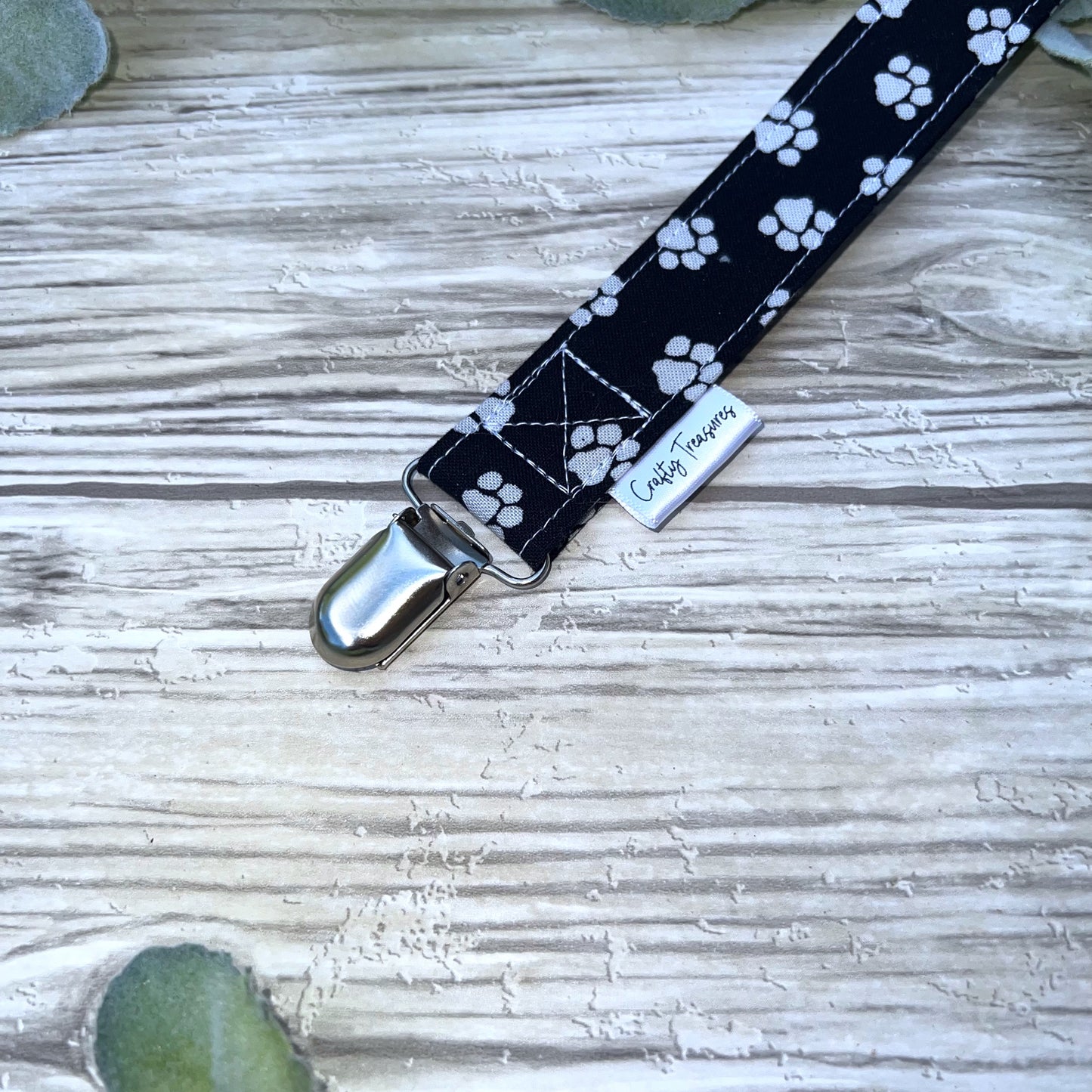 Pawprints on Black Pacifier Clip