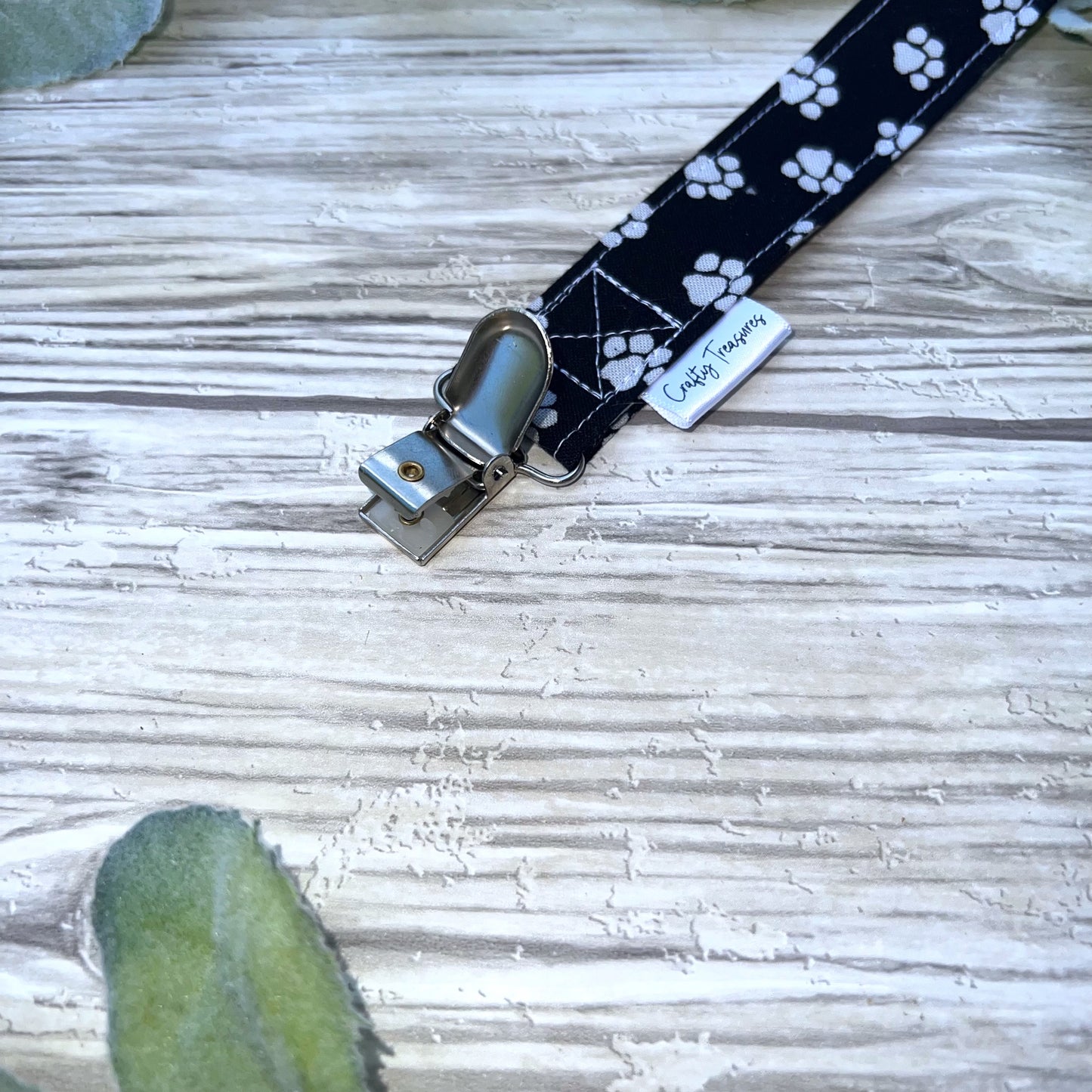 Pawprints on Black Pacifier Clip