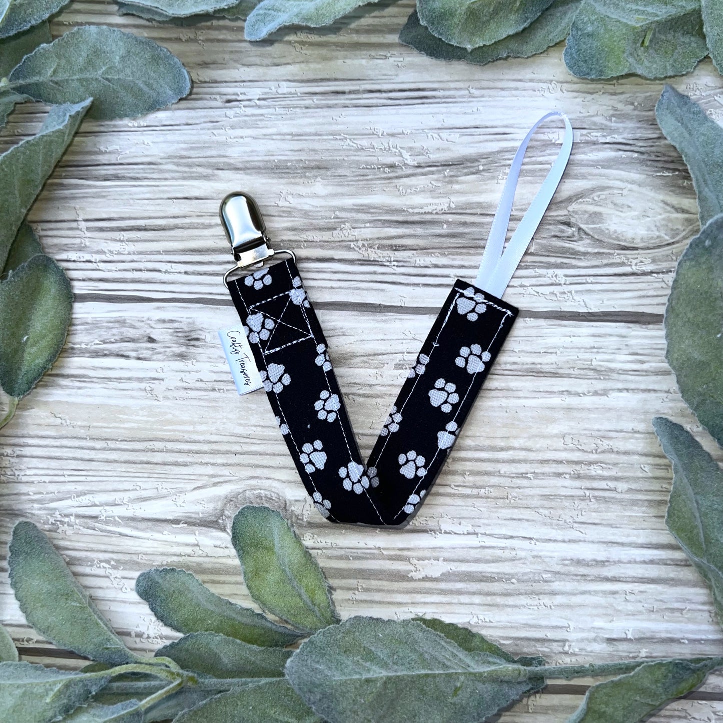 Pawprints on Black Pacifier Clip