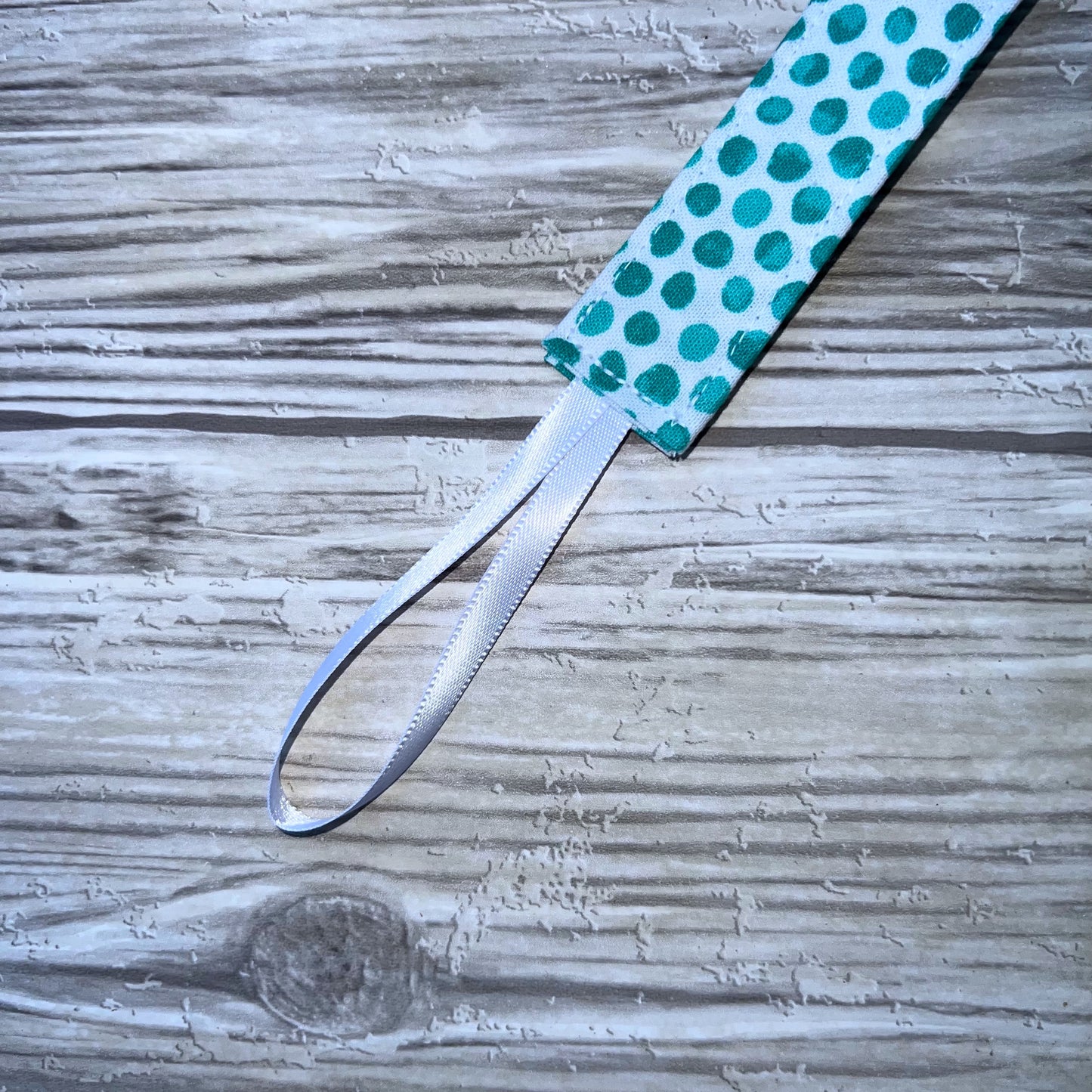 Aqua Dots on White Pacifier Clip